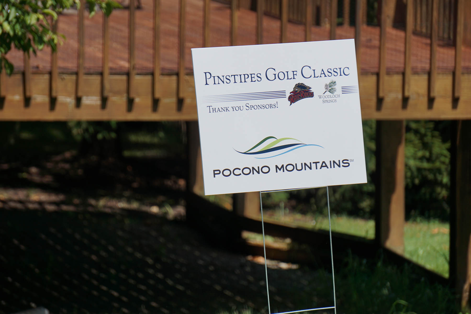 Sign text: Pinstripes Golf Course, Thank you Sponsors! Pocono Mountains.