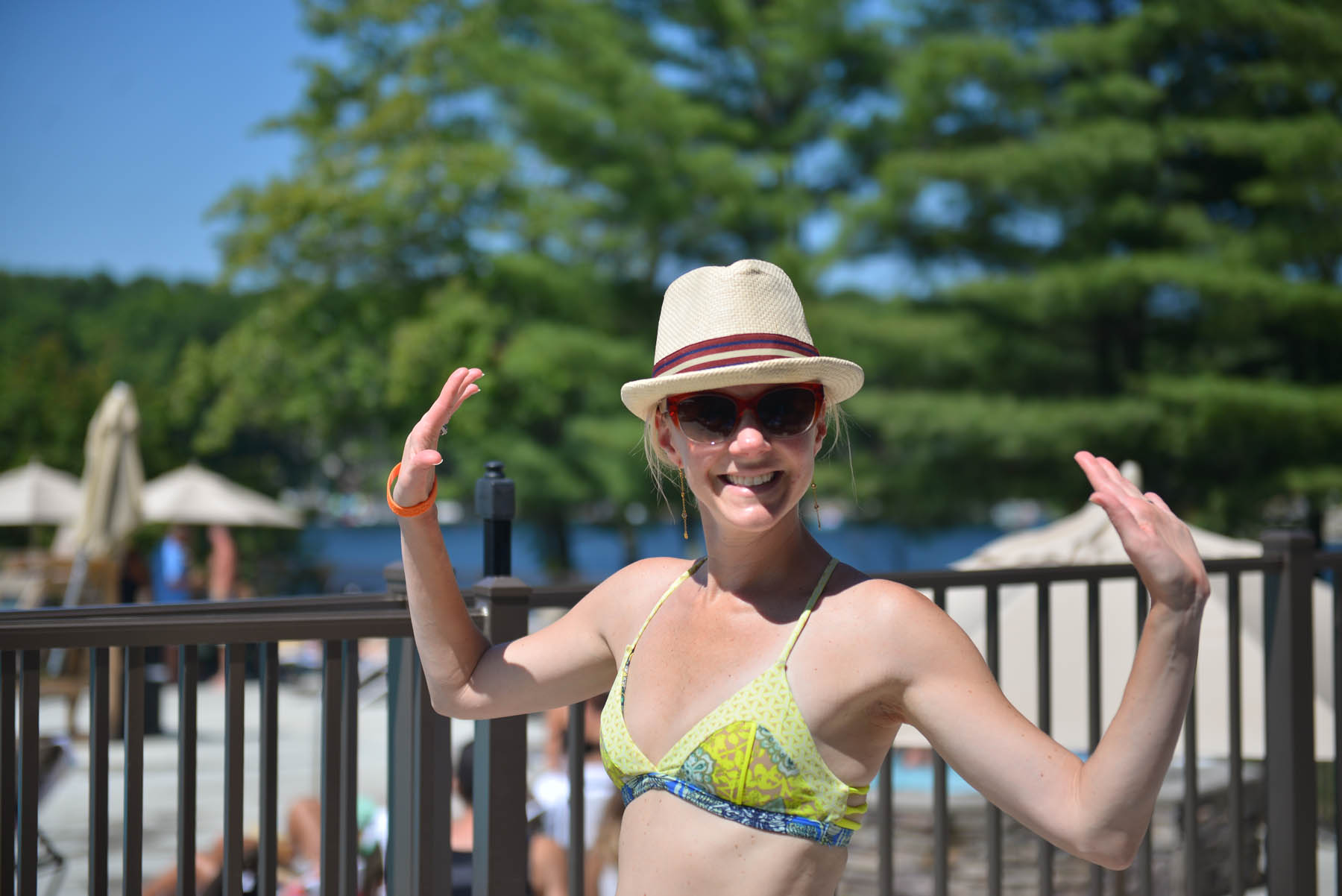Woman posing at outdoor pool.