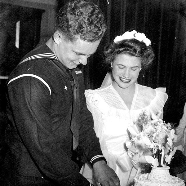 Historic photo of Harry and Mary cutting wedding cake.
