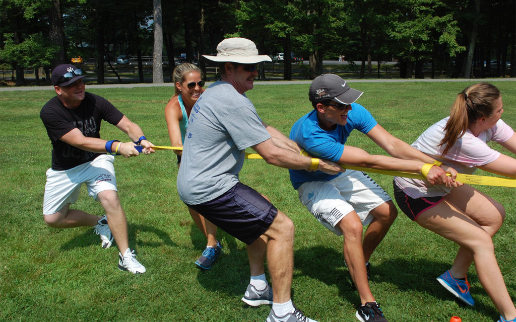 Five guests doing tug of war games.