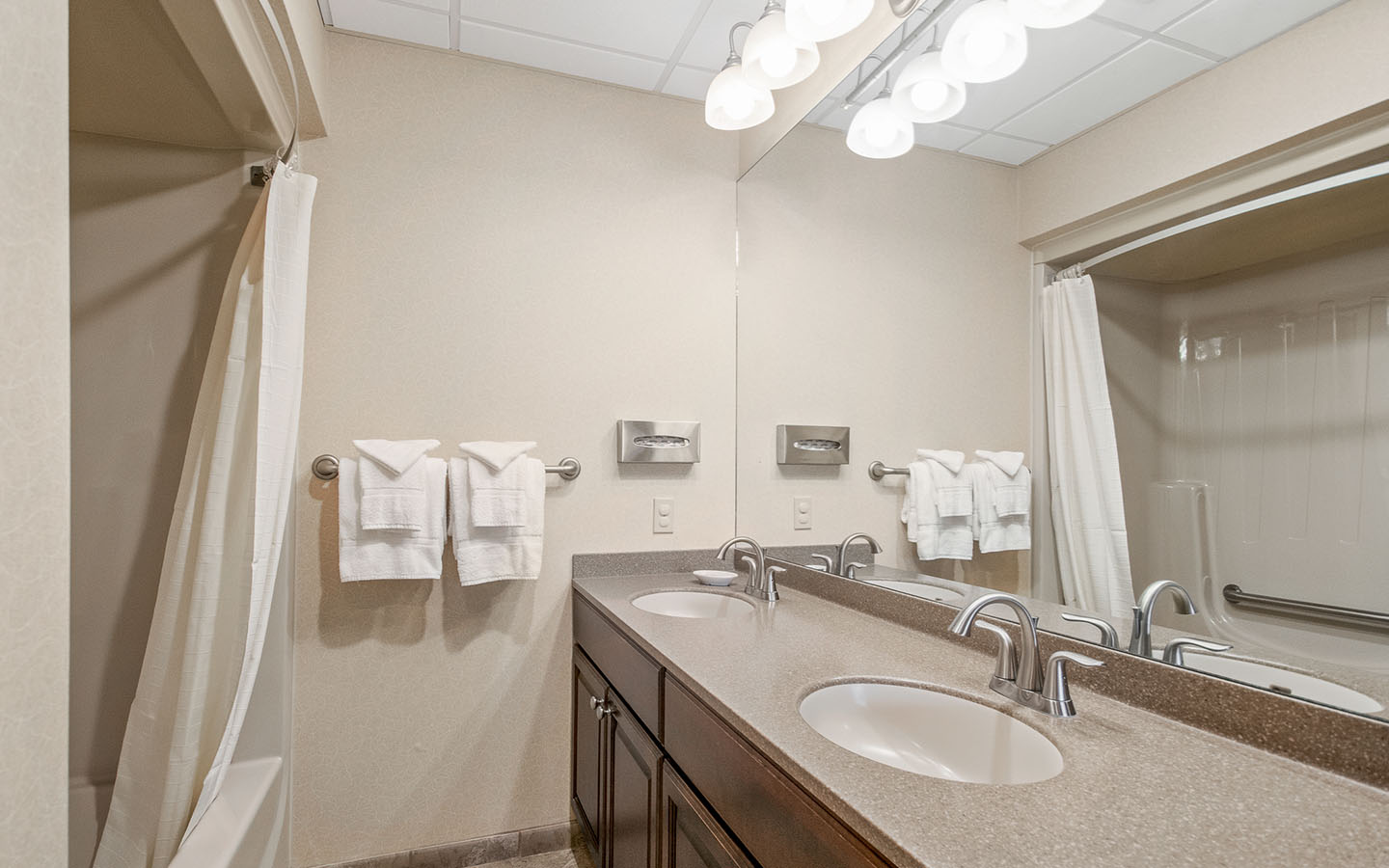 Woodloch suite bathroom with twin vanity sinks.