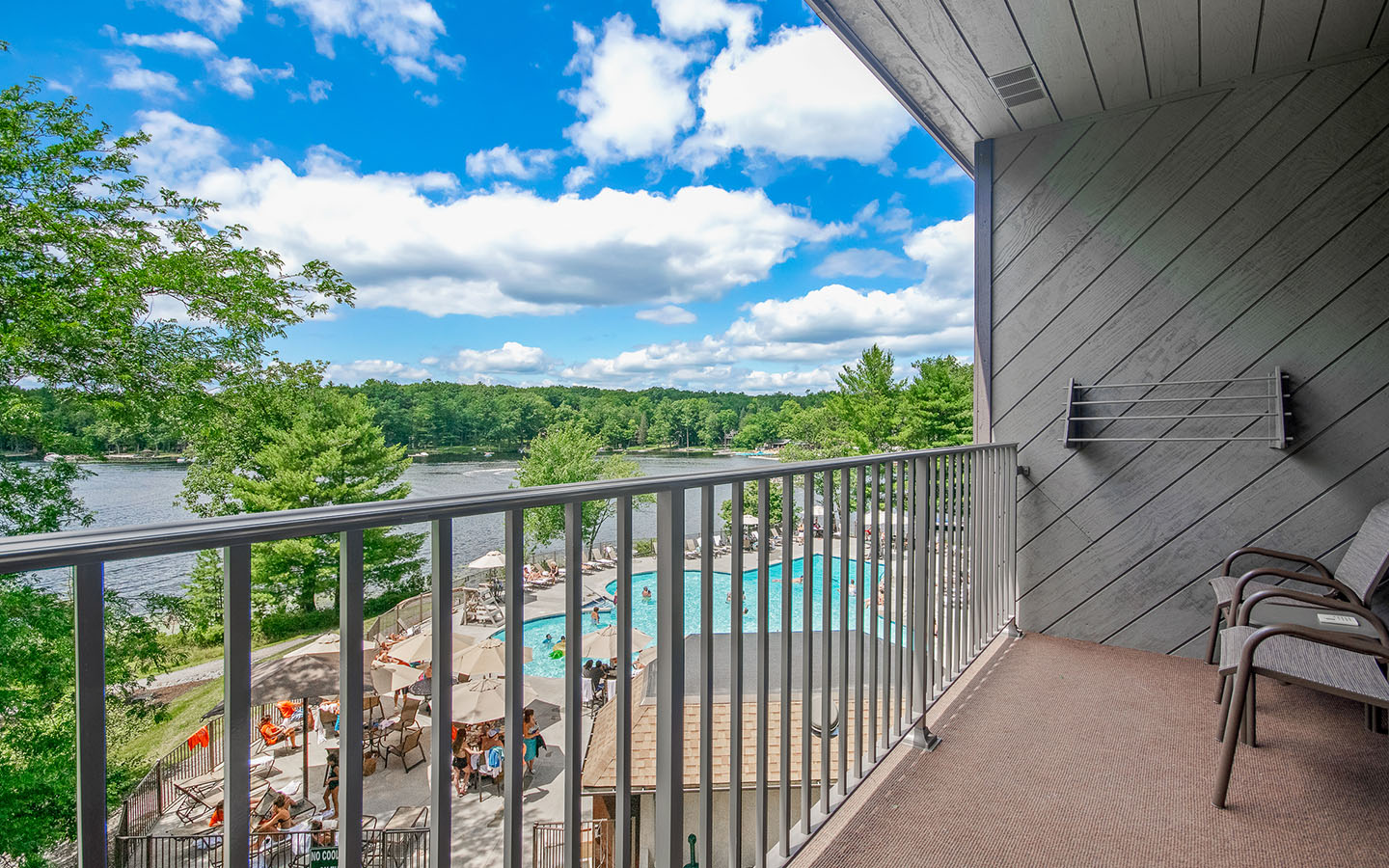 Balcony view of outdoor pool and Lake Teedyuskung.