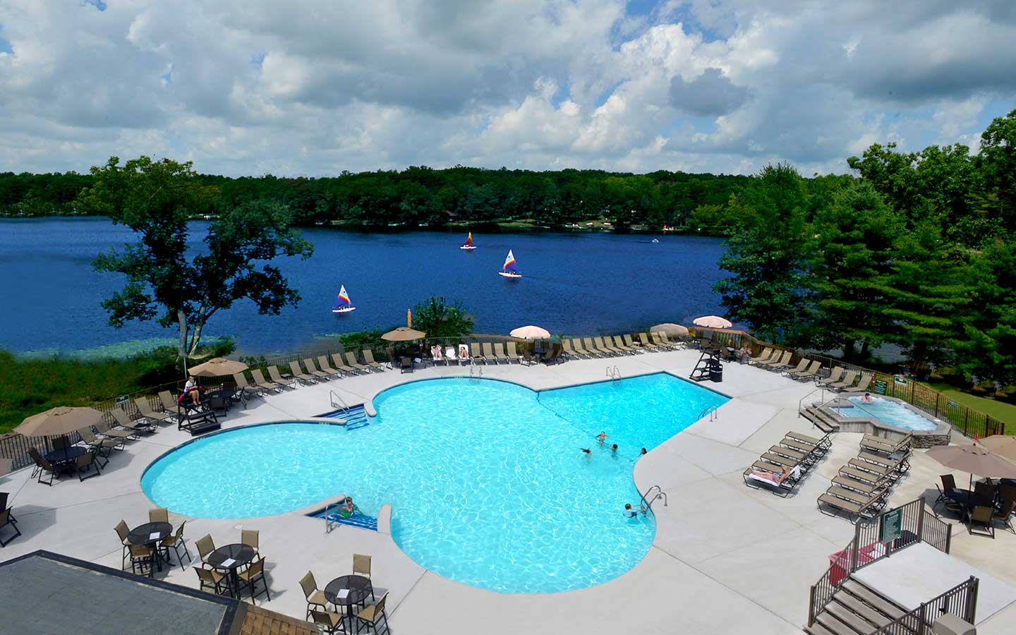 Outdoor pool and view of Lake Teedyuskung.