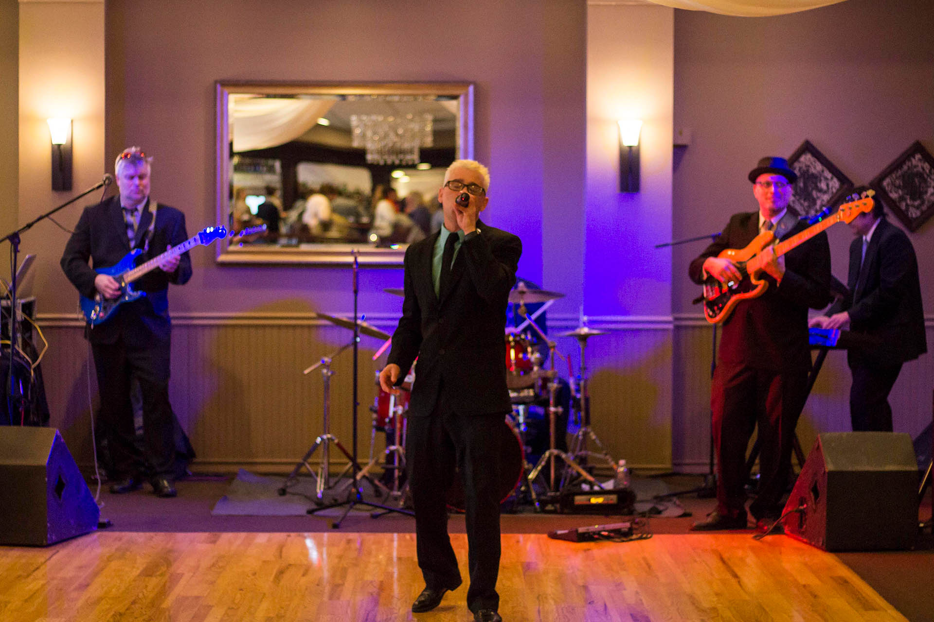 Wedding reception band playing indoors.