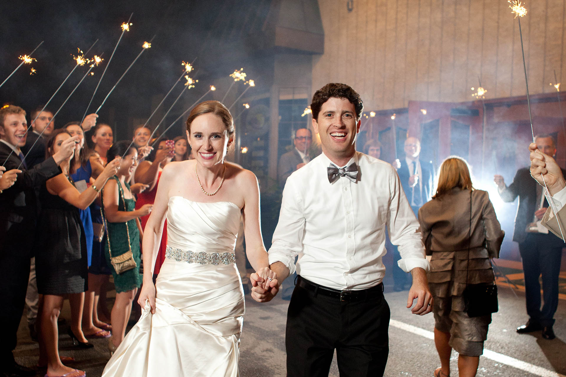 Bride and Groom reception processional under sparkler salute.