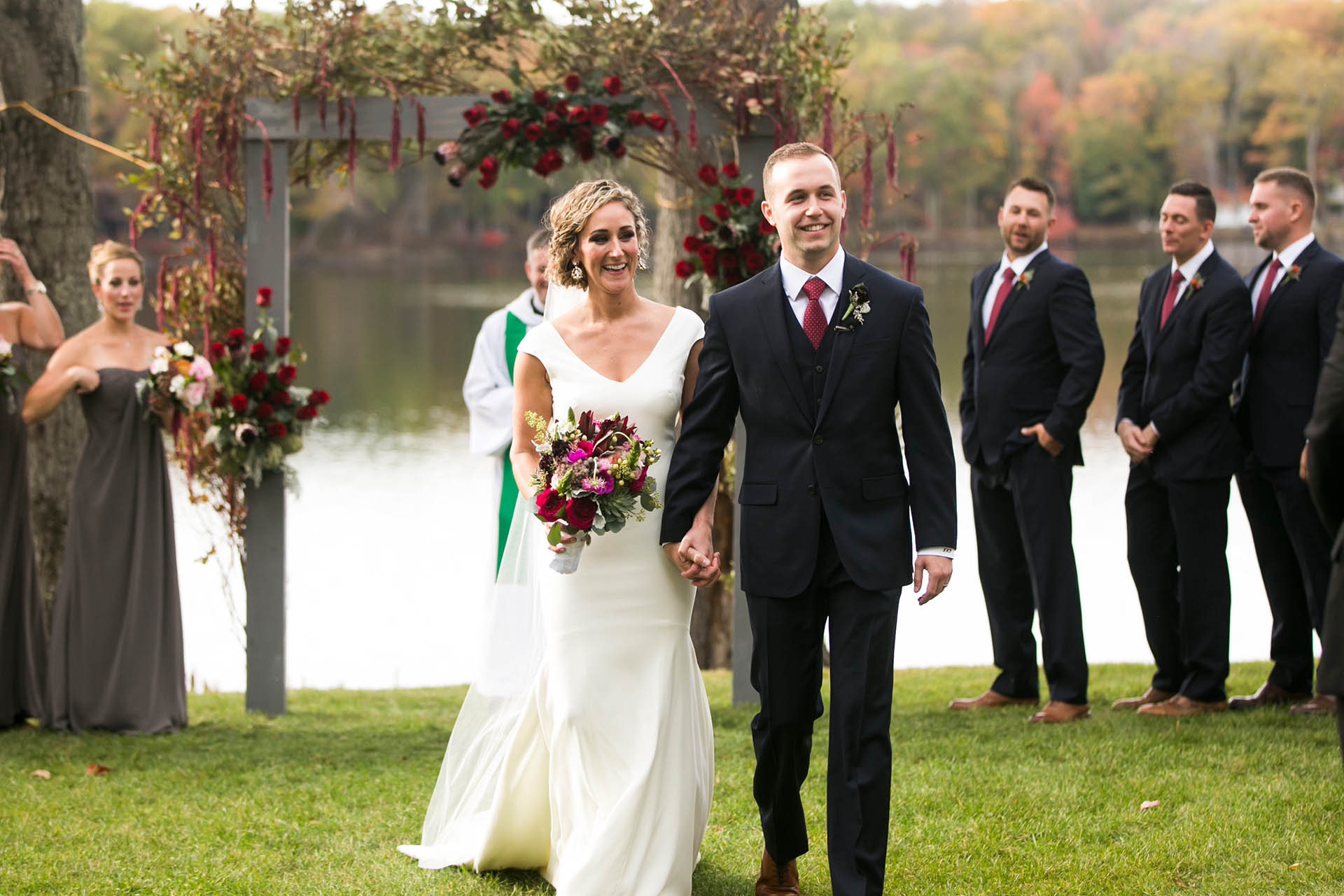 Bride and Groom walking during outdoor wedding recessional.