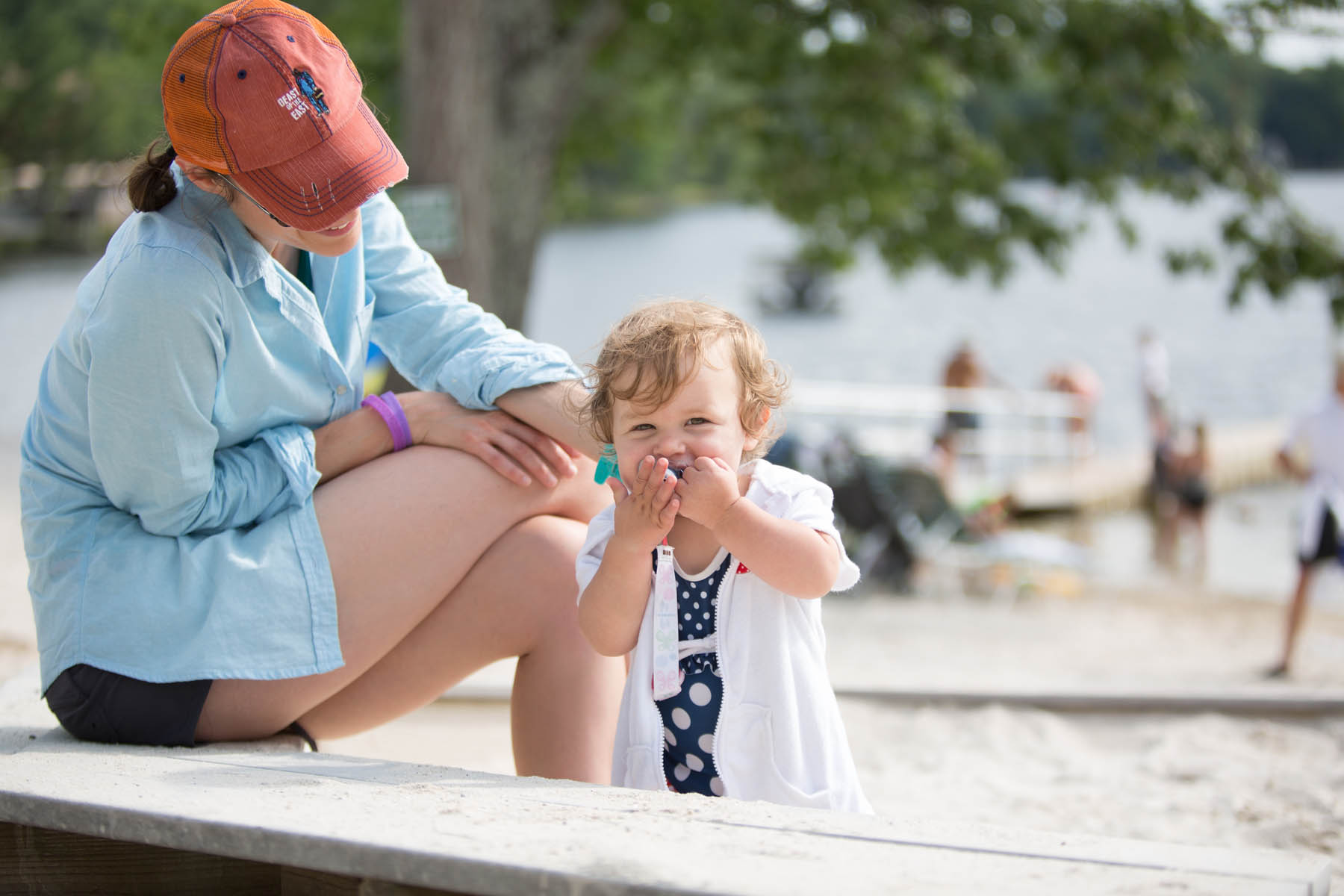 Mom and toddler on the beach.