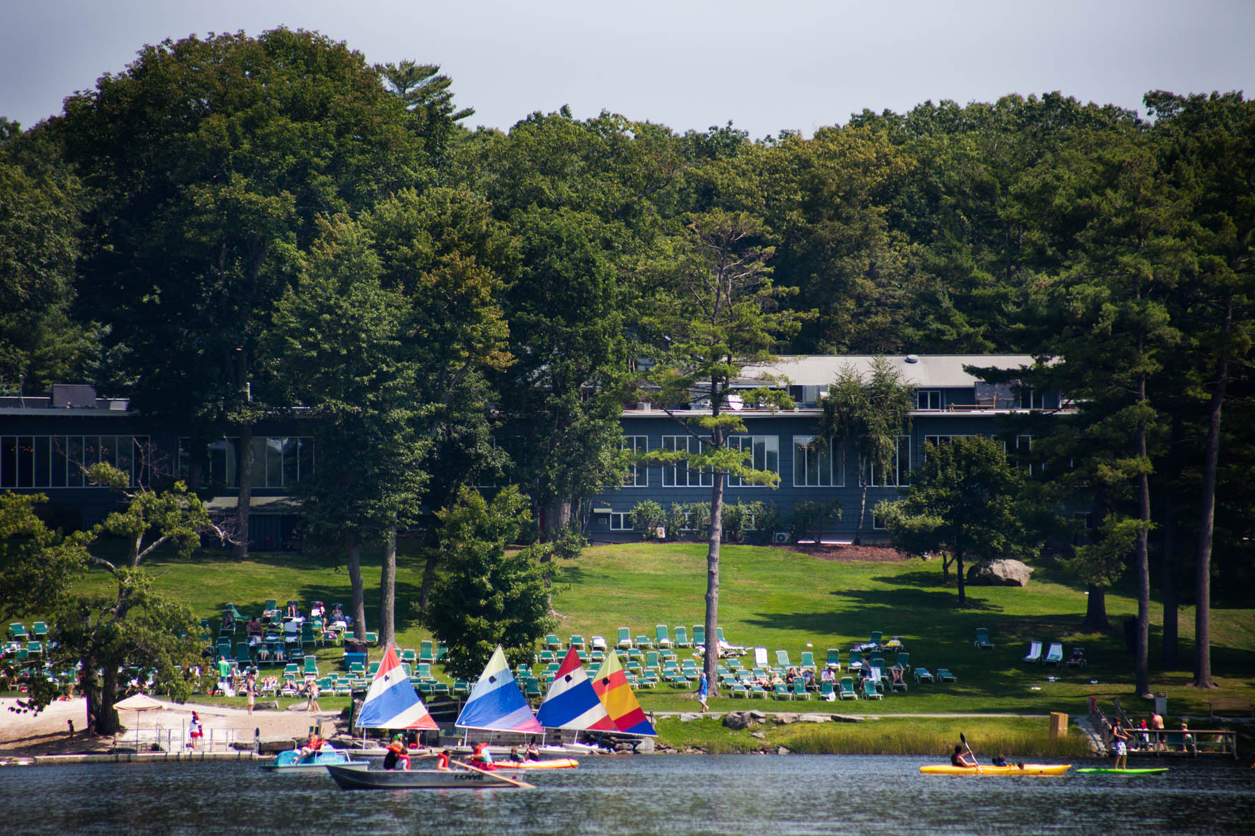 Woodloch beach, small sail boats, kayaks.