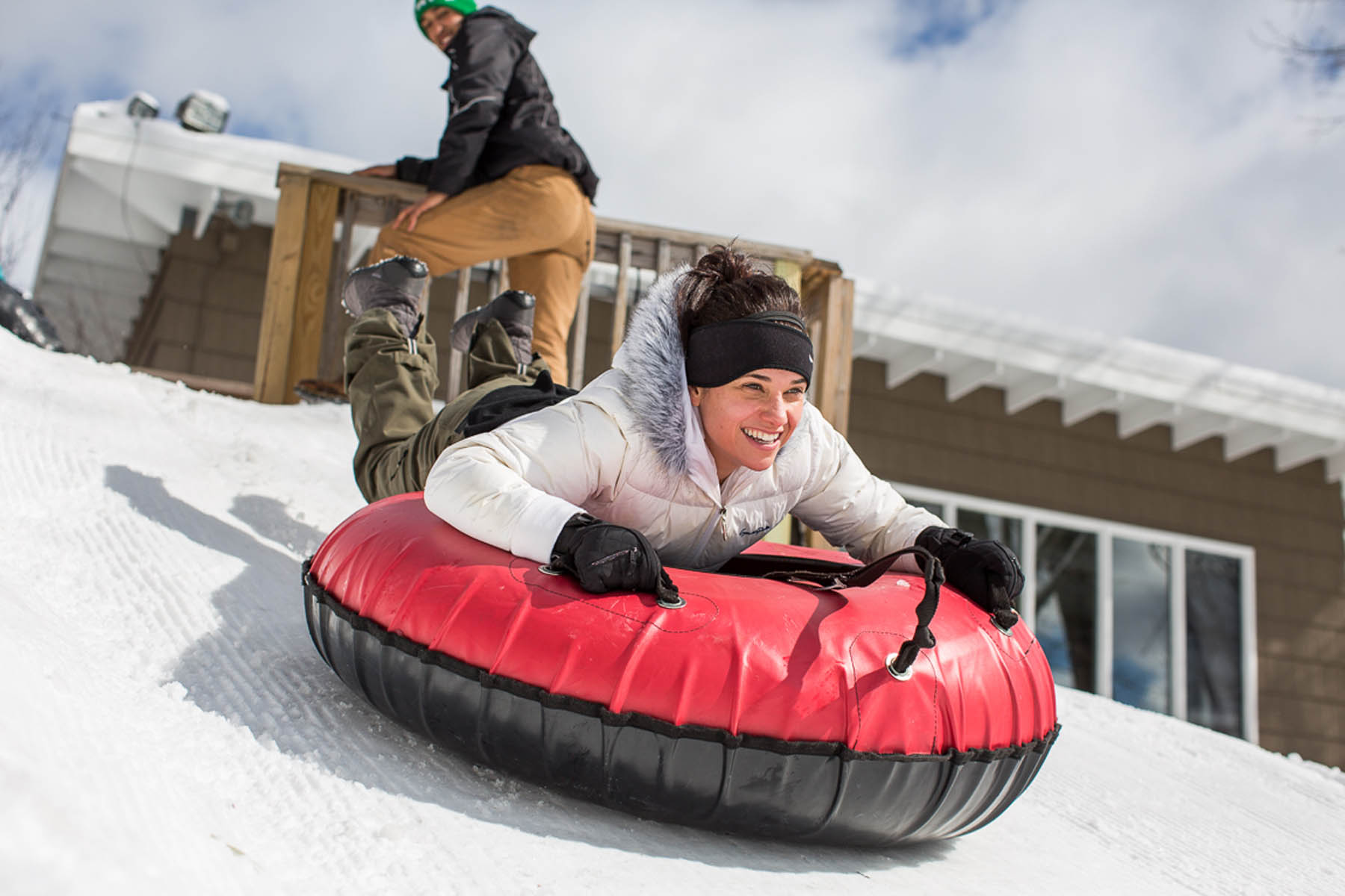 Woman on snowtube.