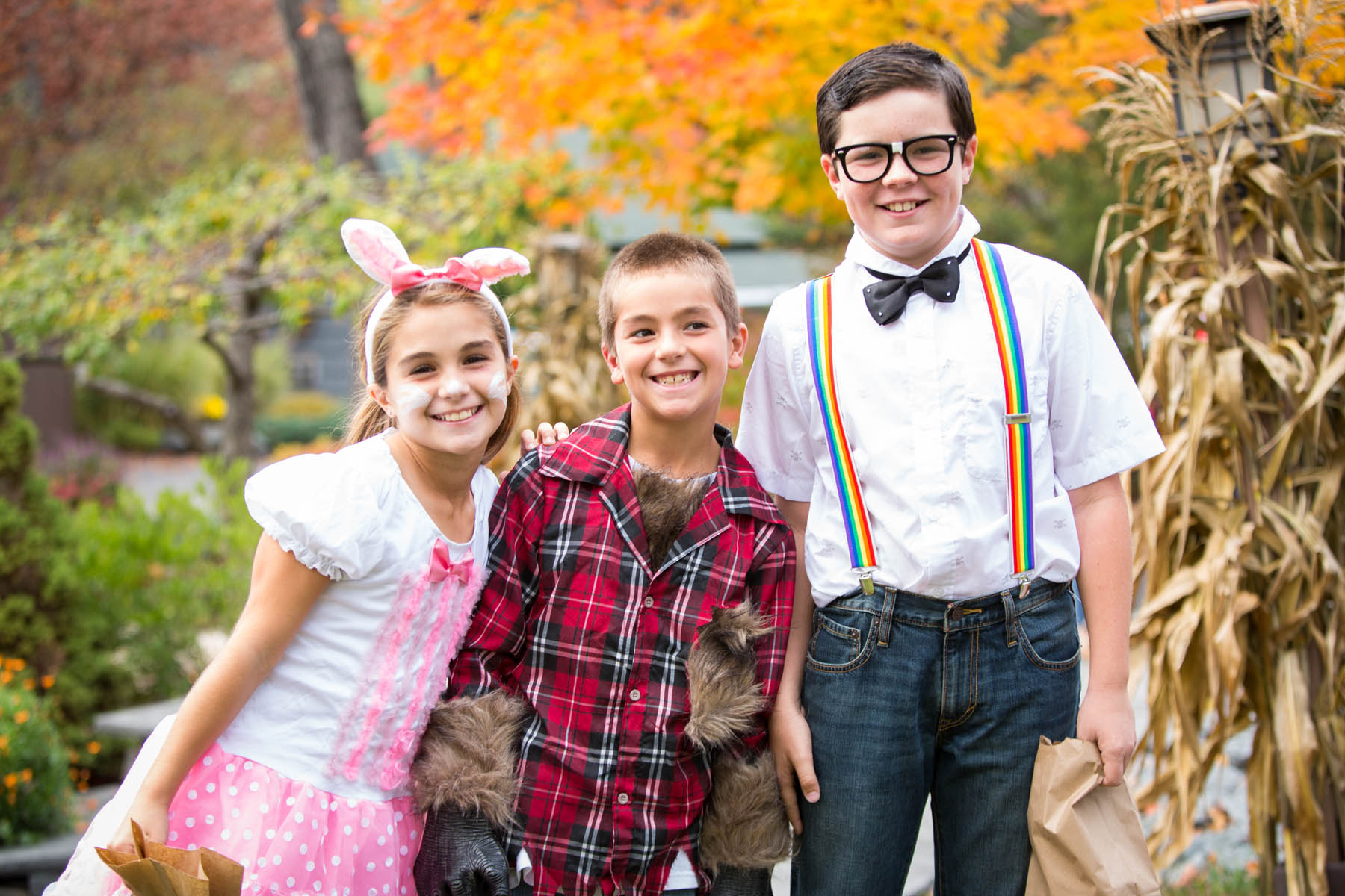 Kids in Halloween costumes. Bunny, Werewolf, and Nerd.