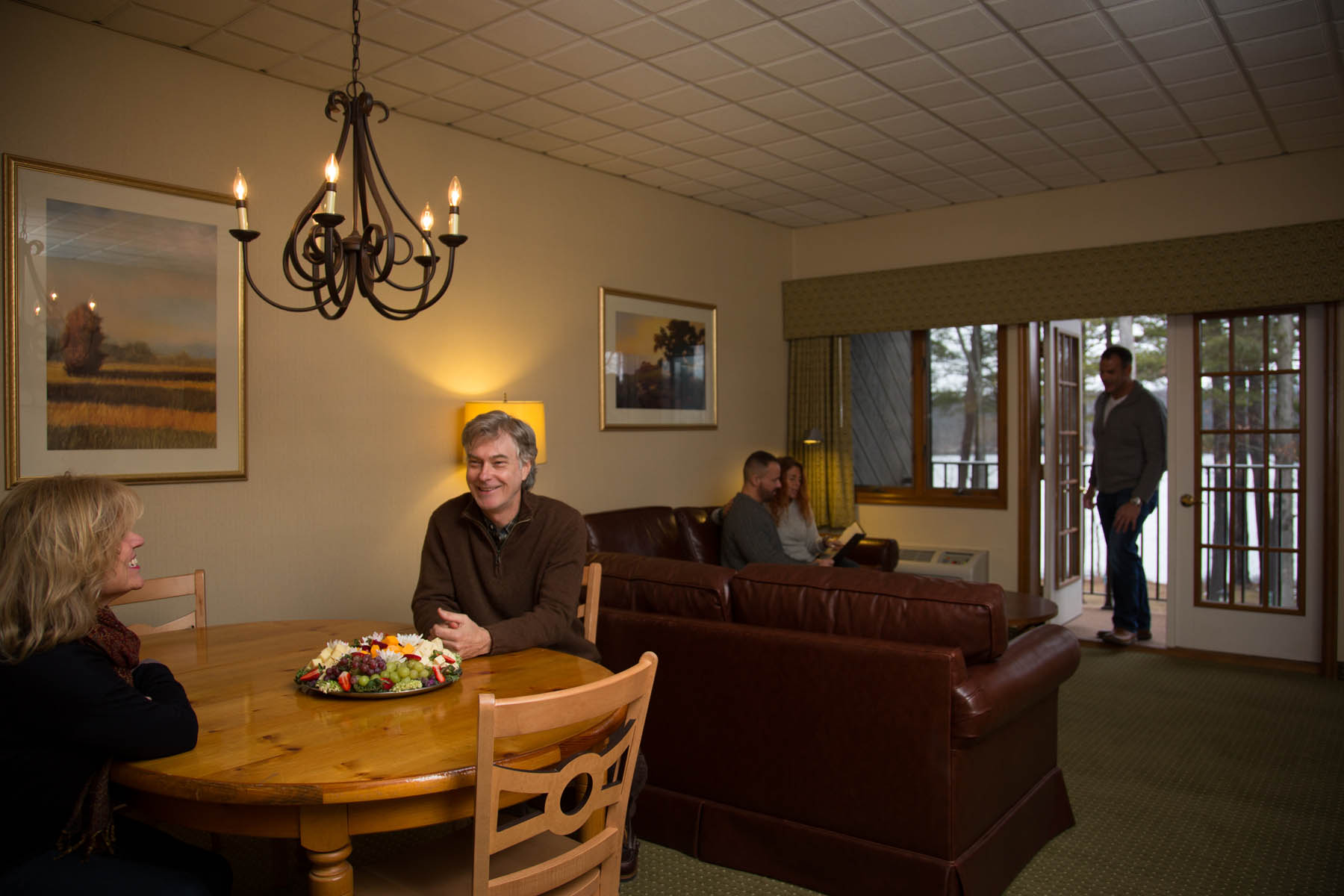 Couples hanging out in a lounge area.