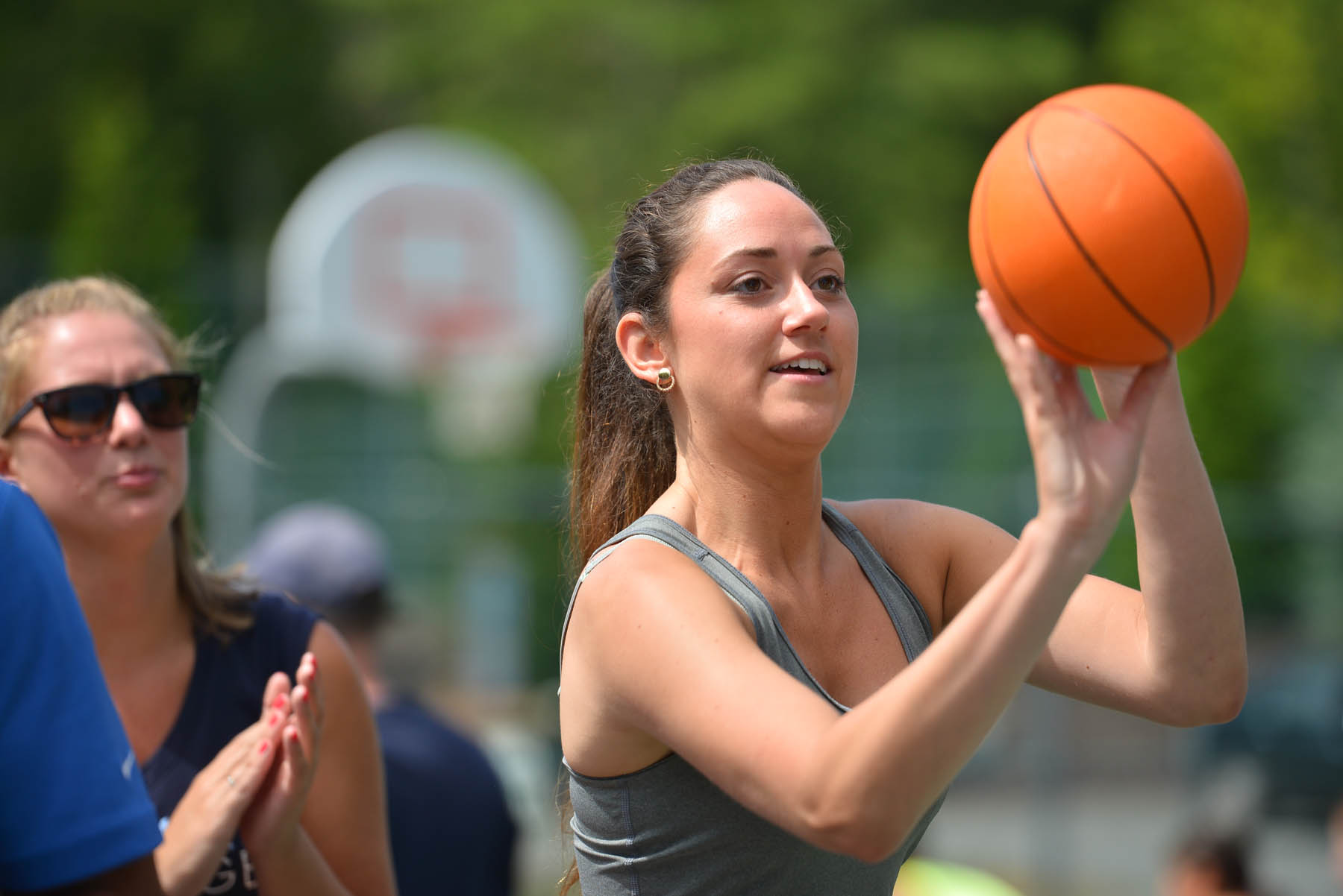Woman shooting a basketball