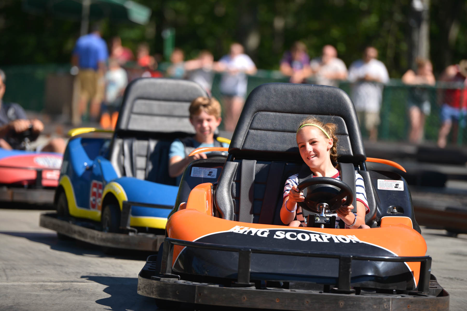 Boy and girl in a gokart.