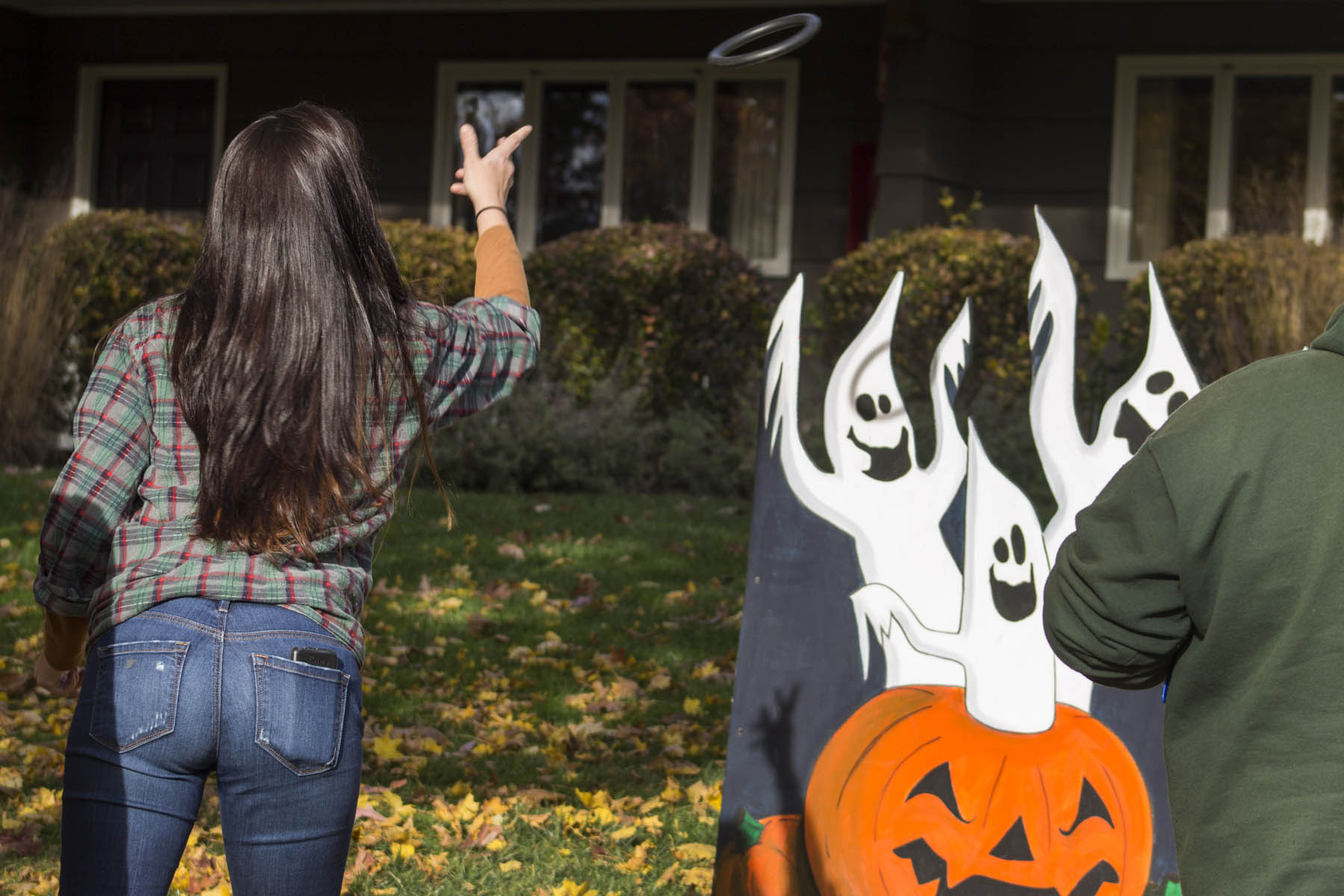 Woman playing ghost ring toss.