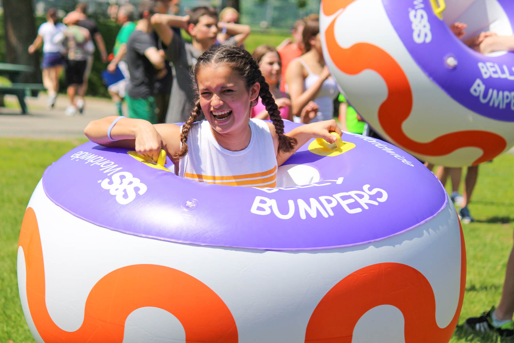 Young woman in belly bumper inner tube.