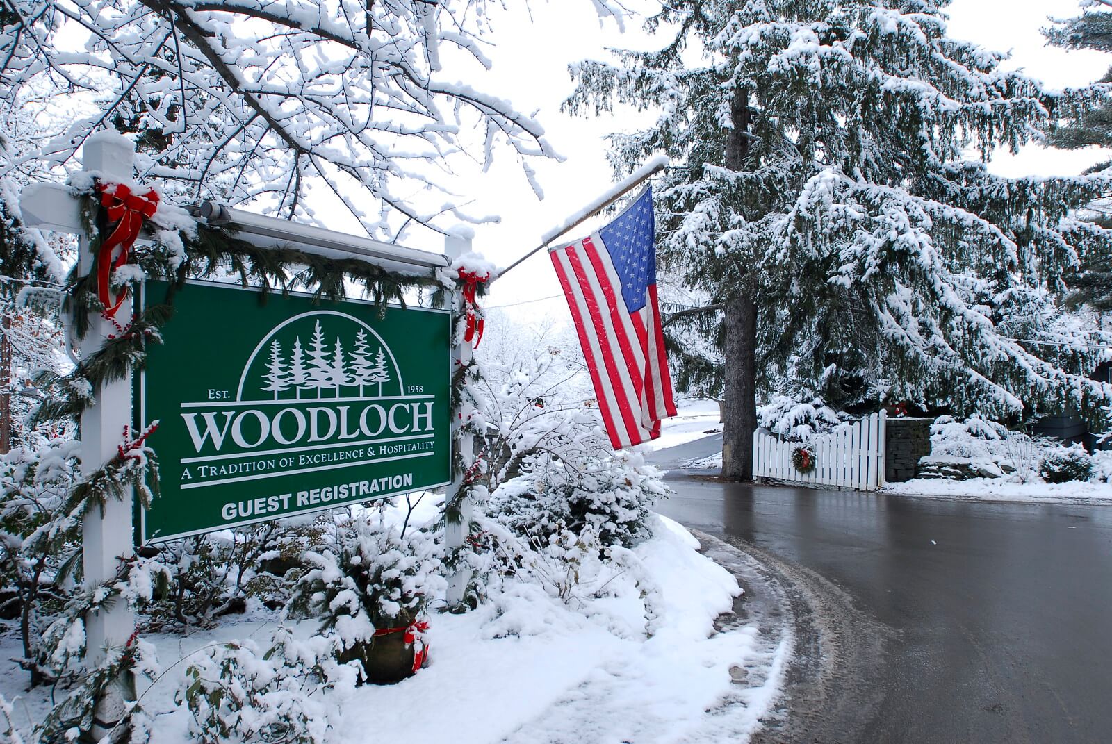 Woodloch entrance sign in winter.