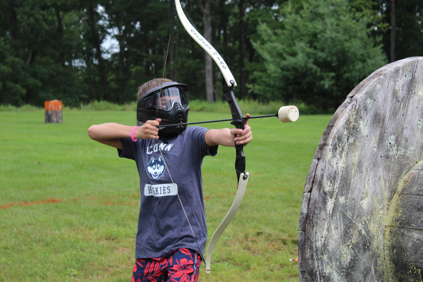 Young boy with safe bow and arrow.