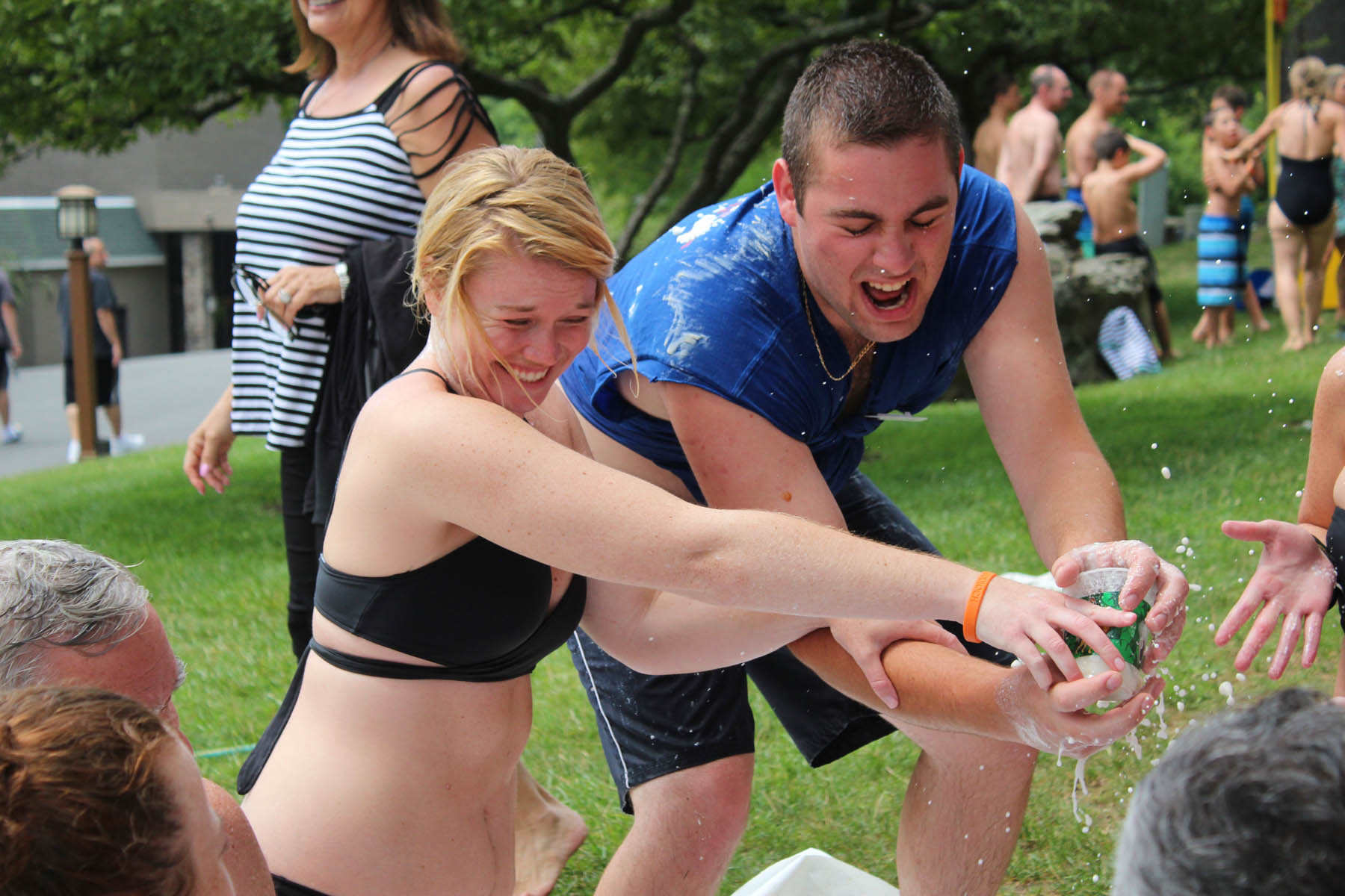 Man and woman holding a water balloon.