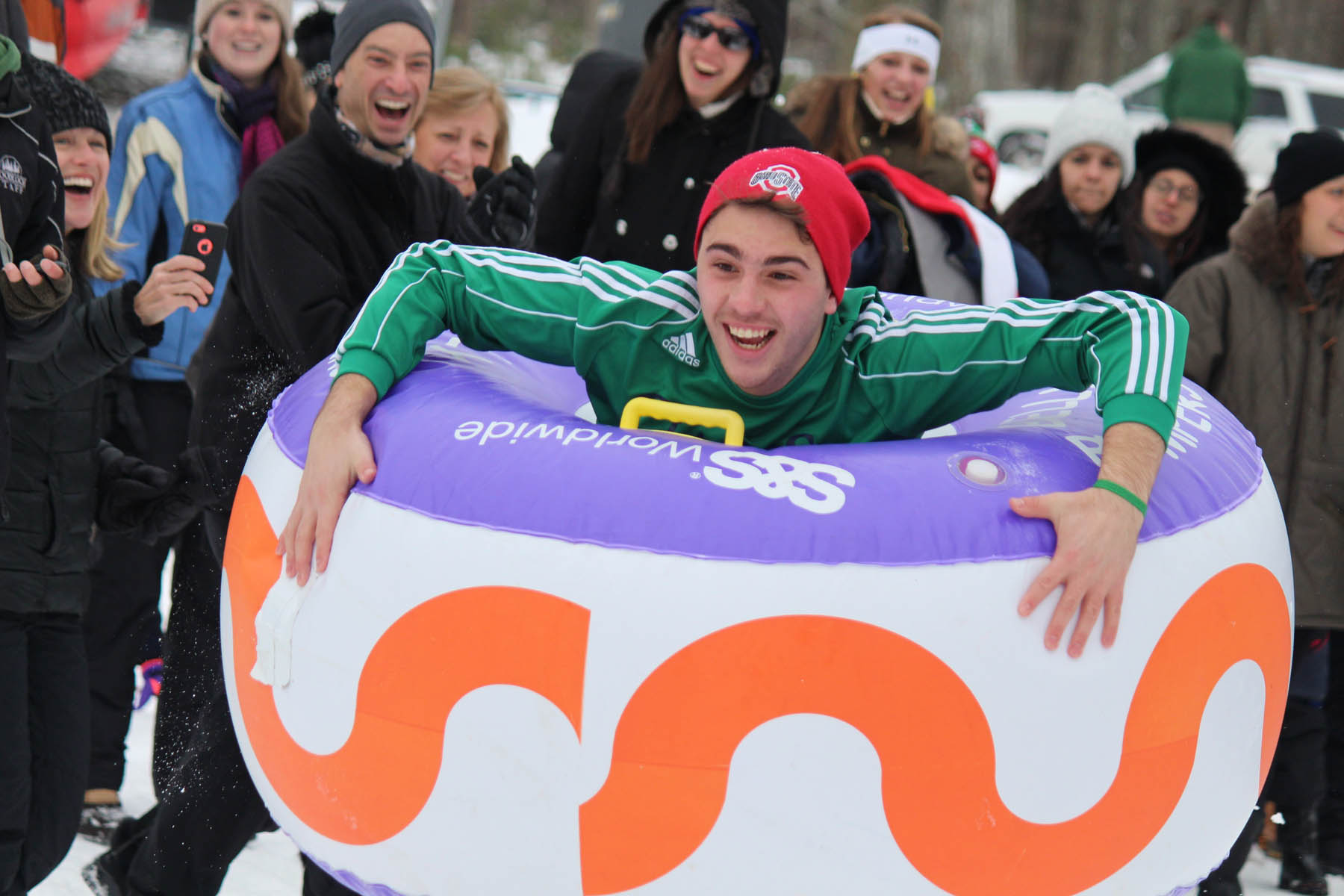 Young man in snow bumper inflatable.