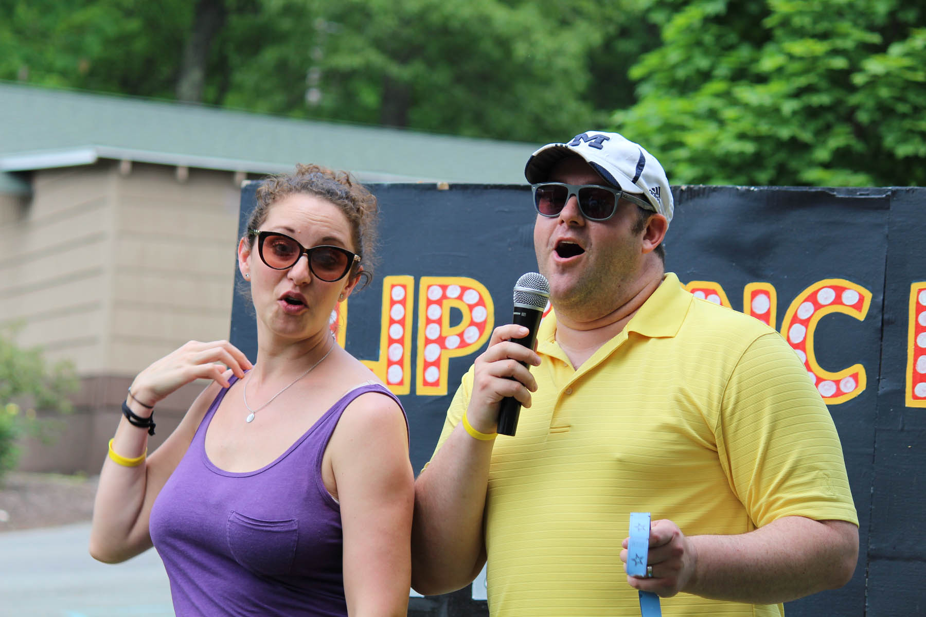 Man and woman doing lip sync challenge.