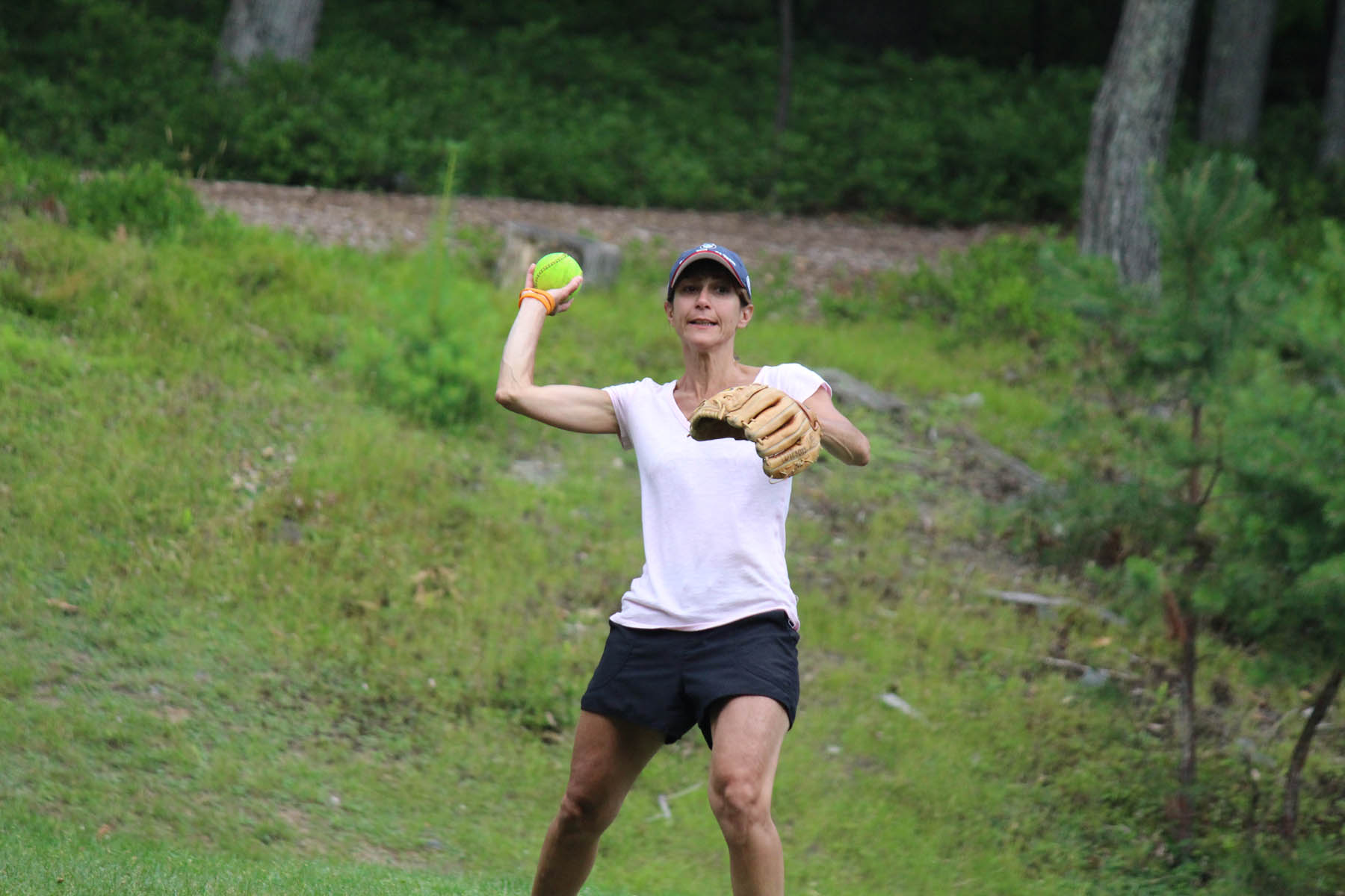 Woman throwing a tennis ball.