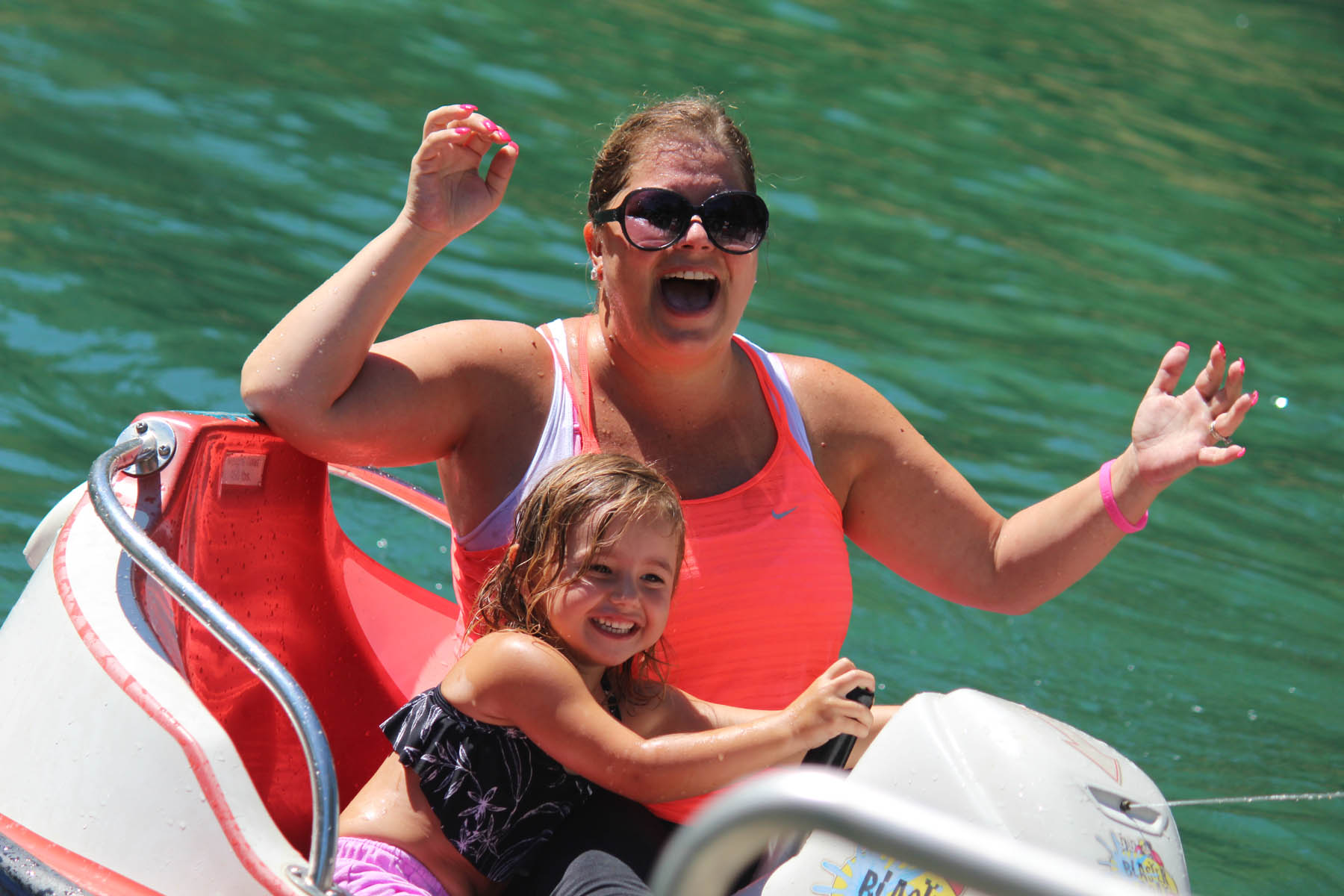 Mother and daughter in bumper boat.