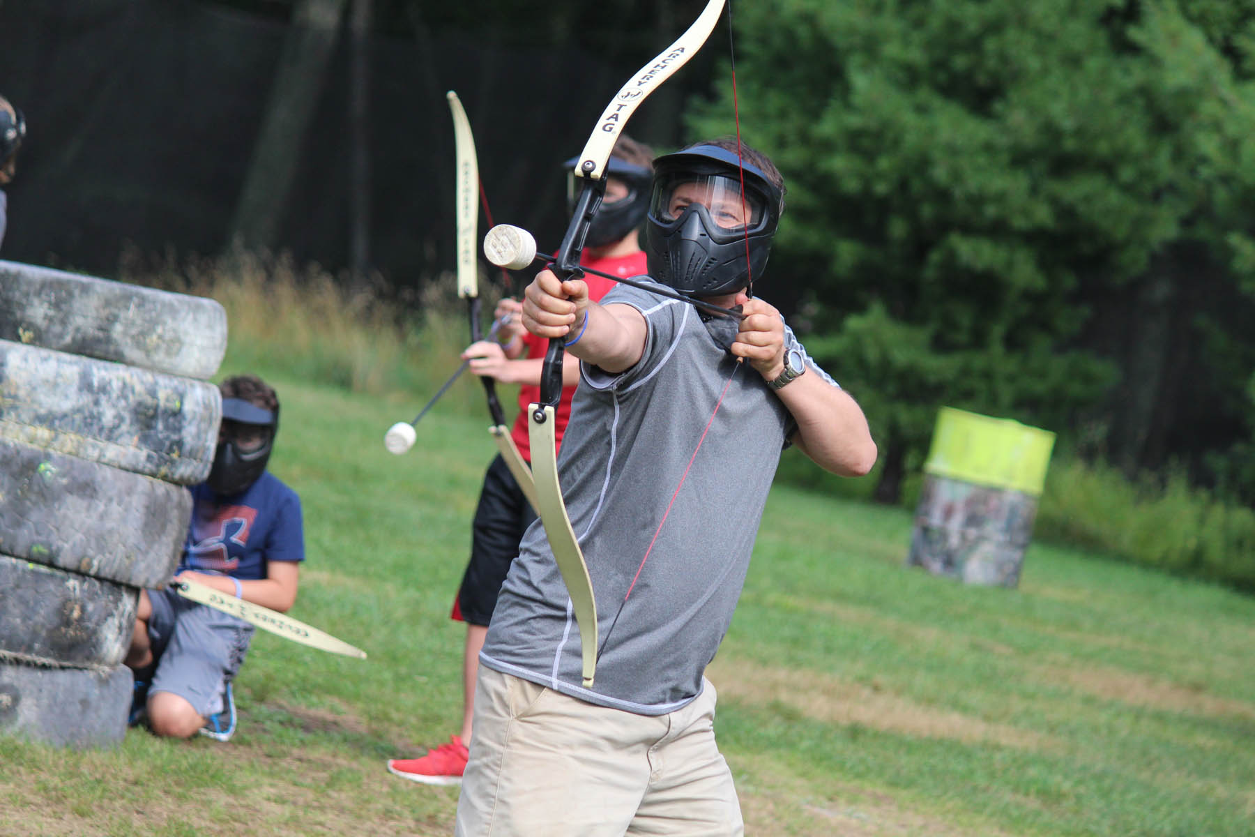 Person aiming safe bow and arrow.