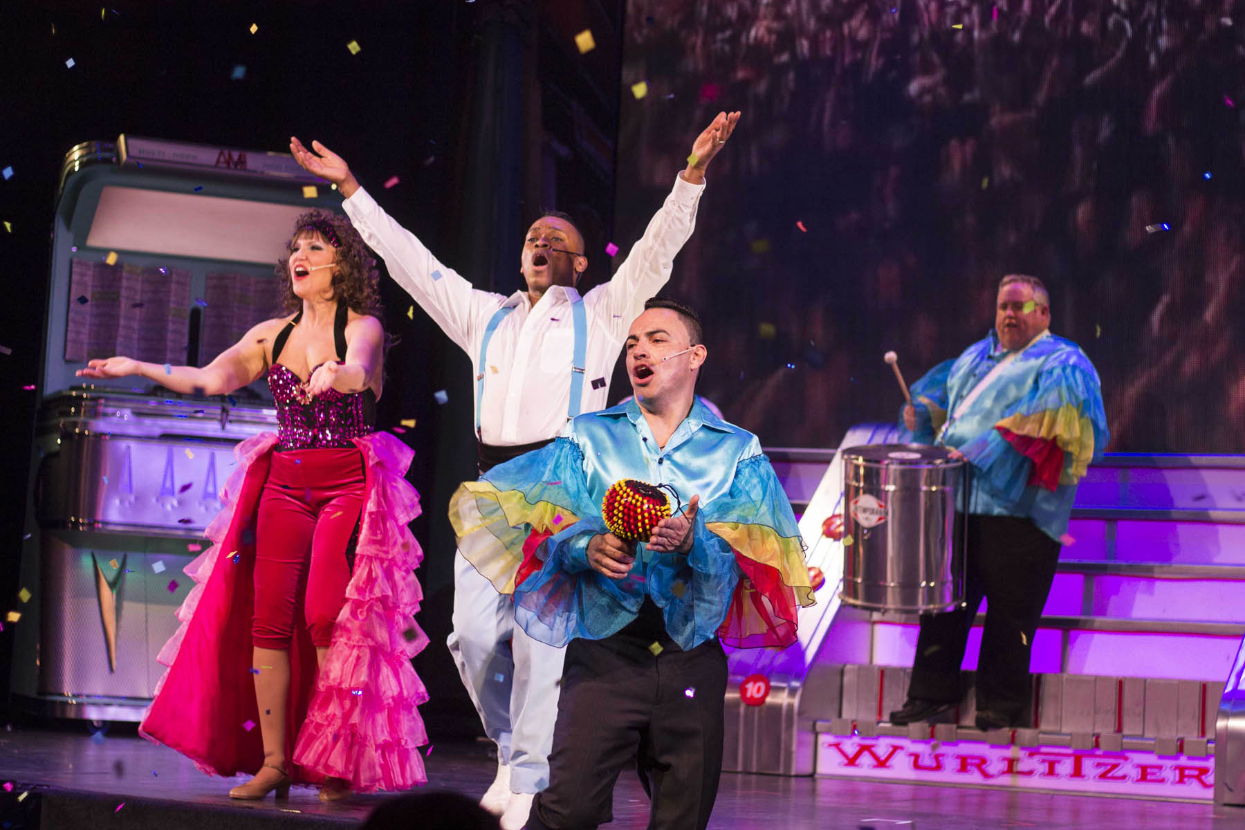 Group of men and women performing Latin music.