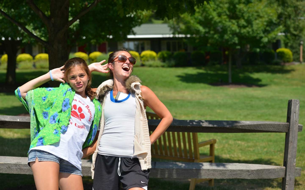 two young women doing a funny fashion pose.