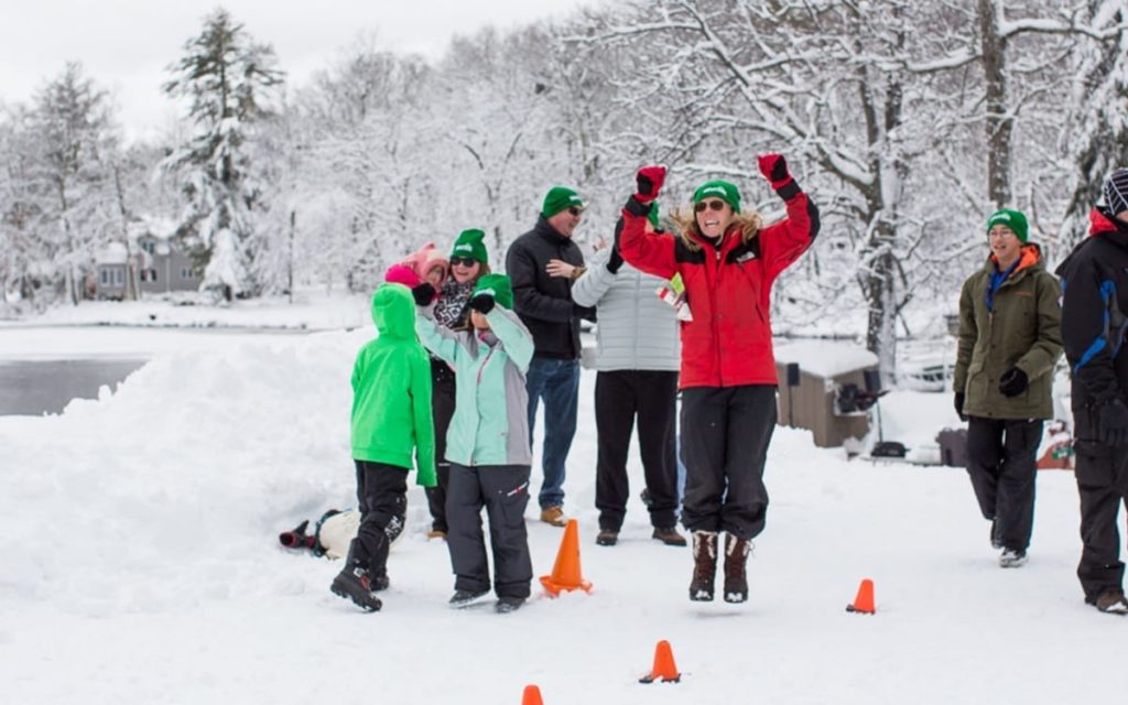 Woman cheering in winter snow.