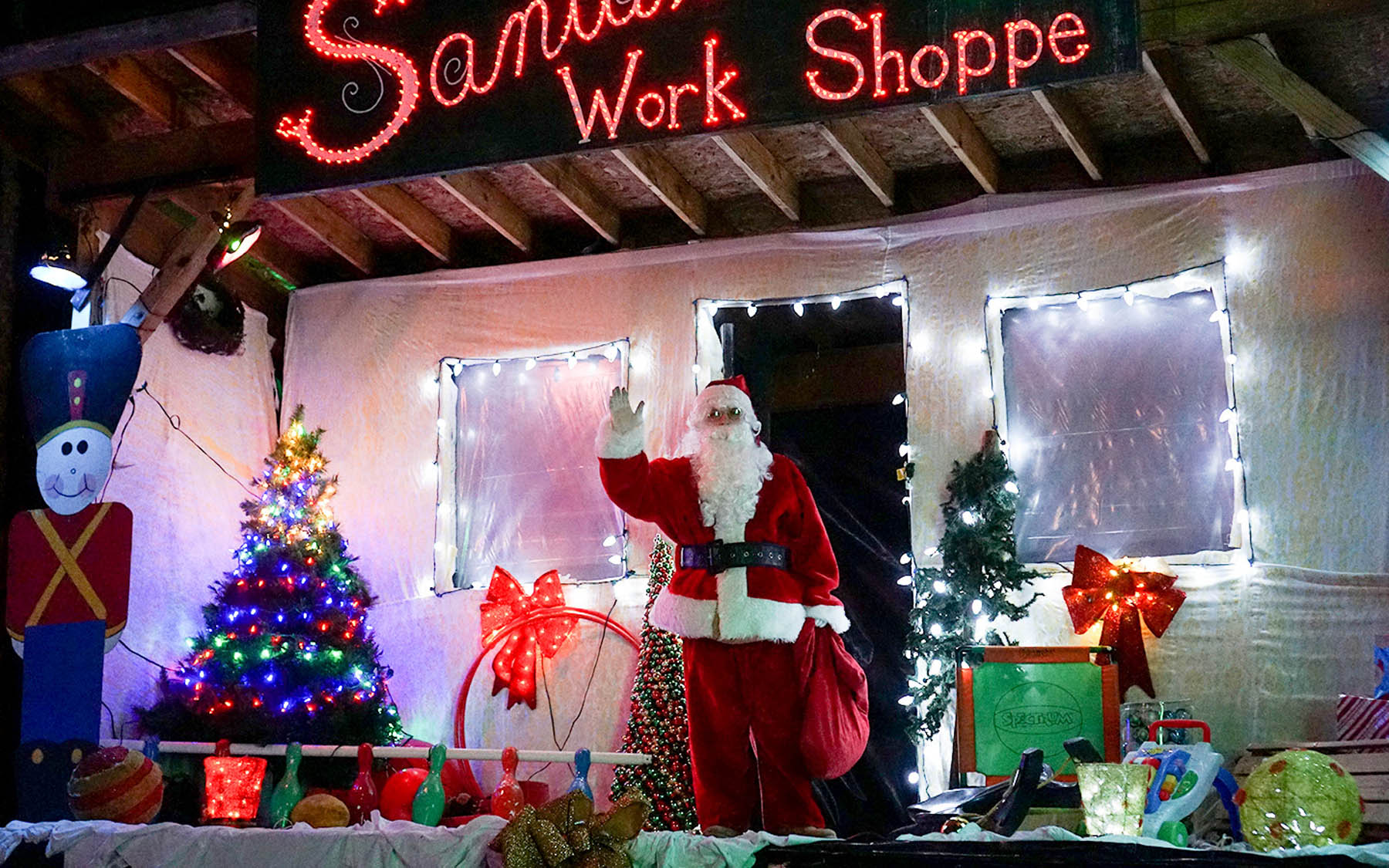 Santa waving from Festival of Lights set.