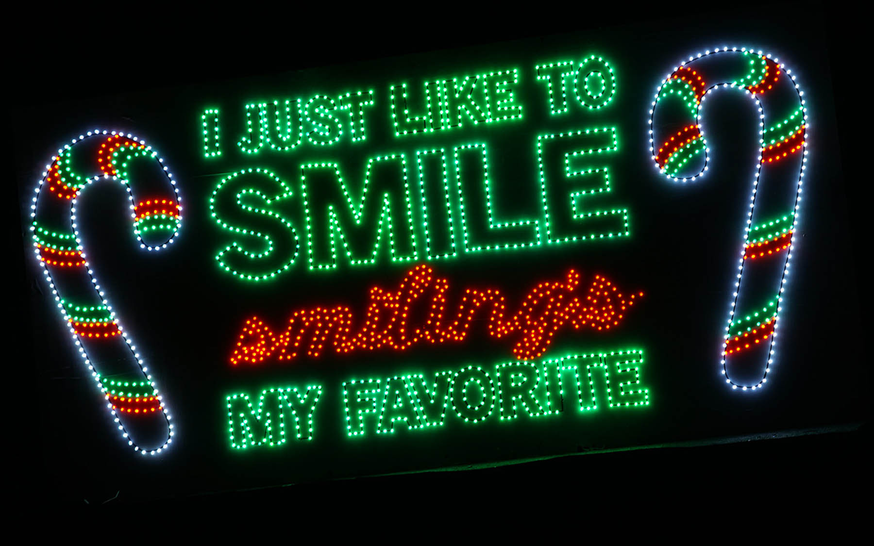 Holiday lights. Text: I just like to smile. Smiling's my favorite.