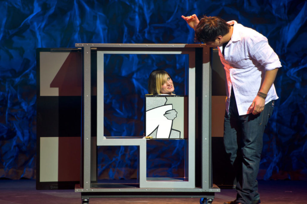 Woman participating in a magic show.