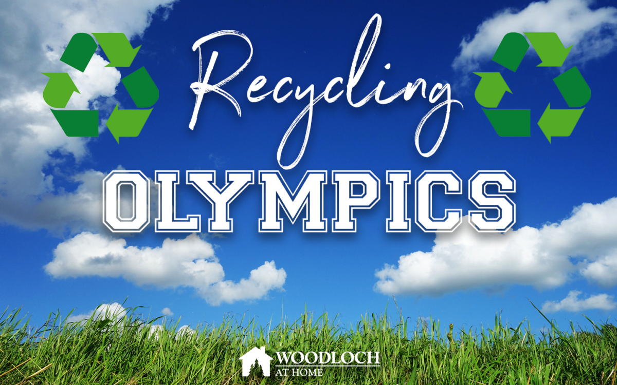 Grass and blue skies. Text: Recycling Olympics, Woodloch at Home.