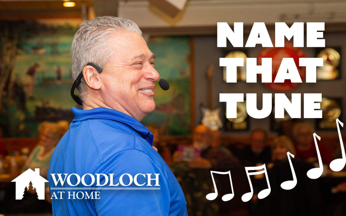 Woodloch employee with headset. Text: Name that tune, Woodloch at home.