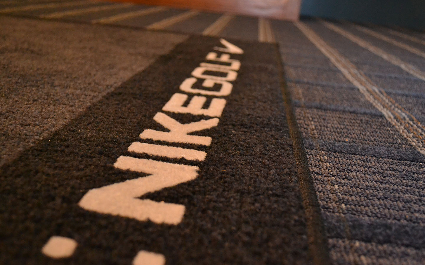 Close up of floormat. Text: Nikegolf.