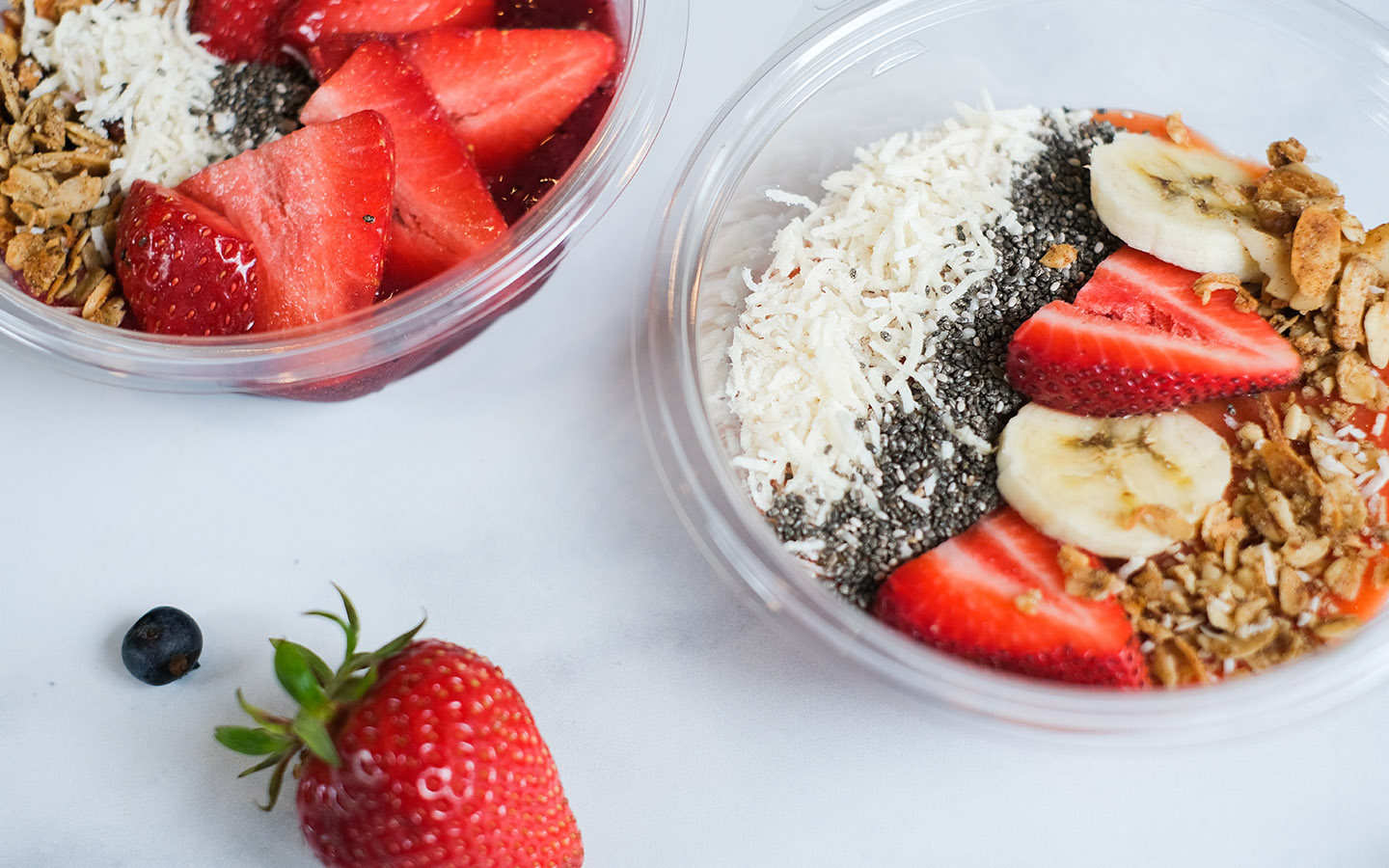 Bowl with granola, fruit, seeds and cheese.