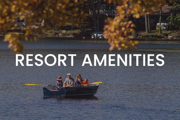 Family in a boat on the lake. Text: Resort Amenities.