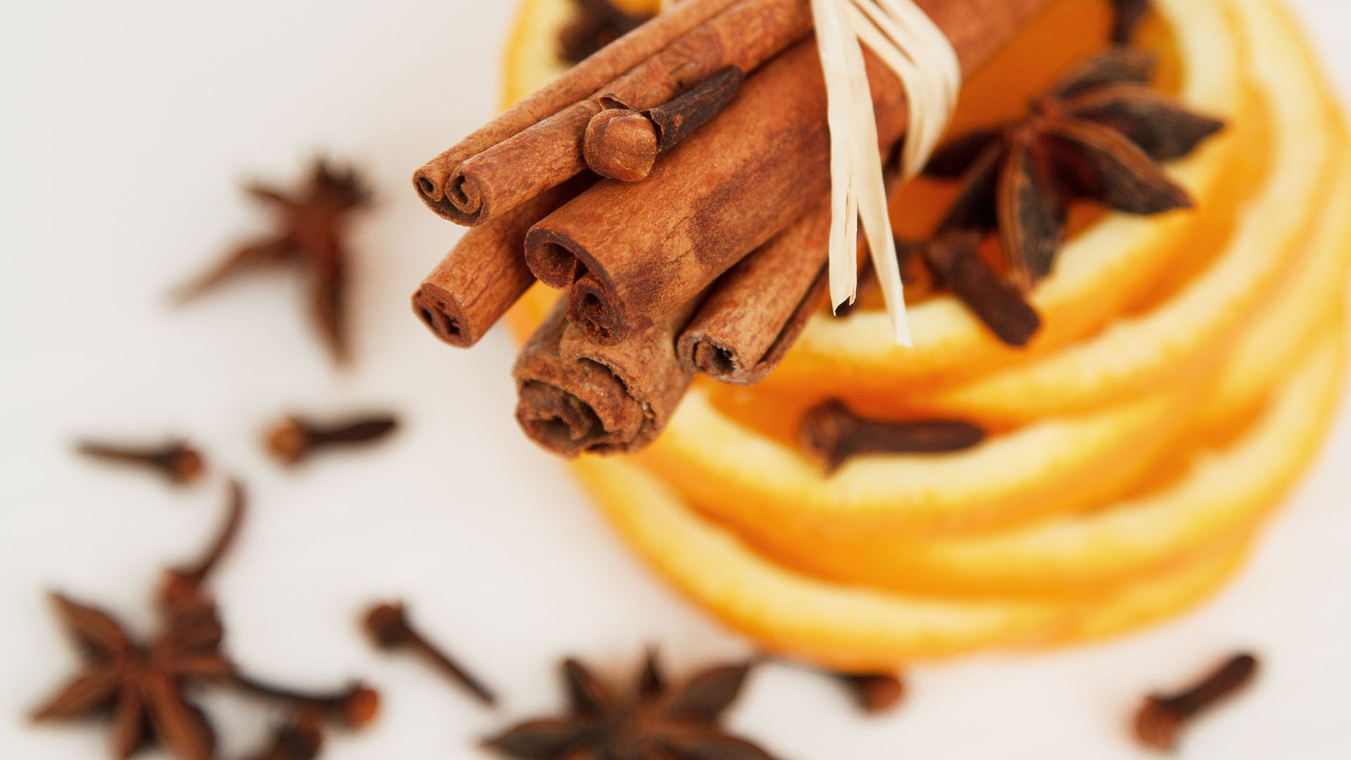 cinnamon sticks, oranges, cloves, ingredients for hot apple cider. 