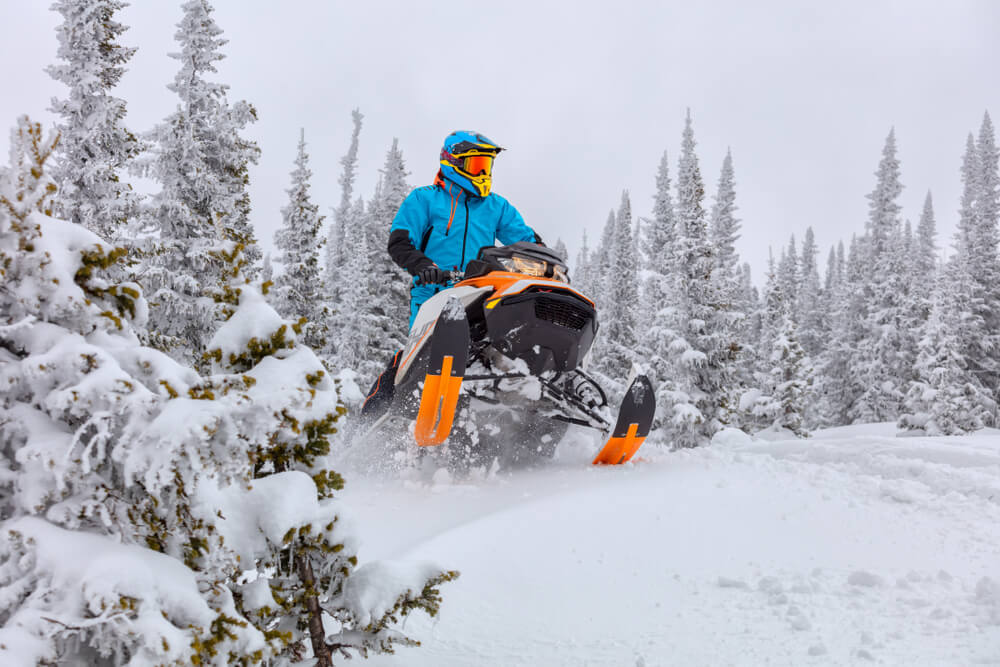 Photo of a person snowmobiling in the Poconos