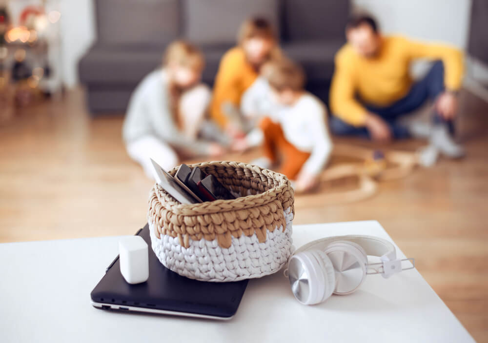 Photo of electronics in a basket during a digital detox challenge