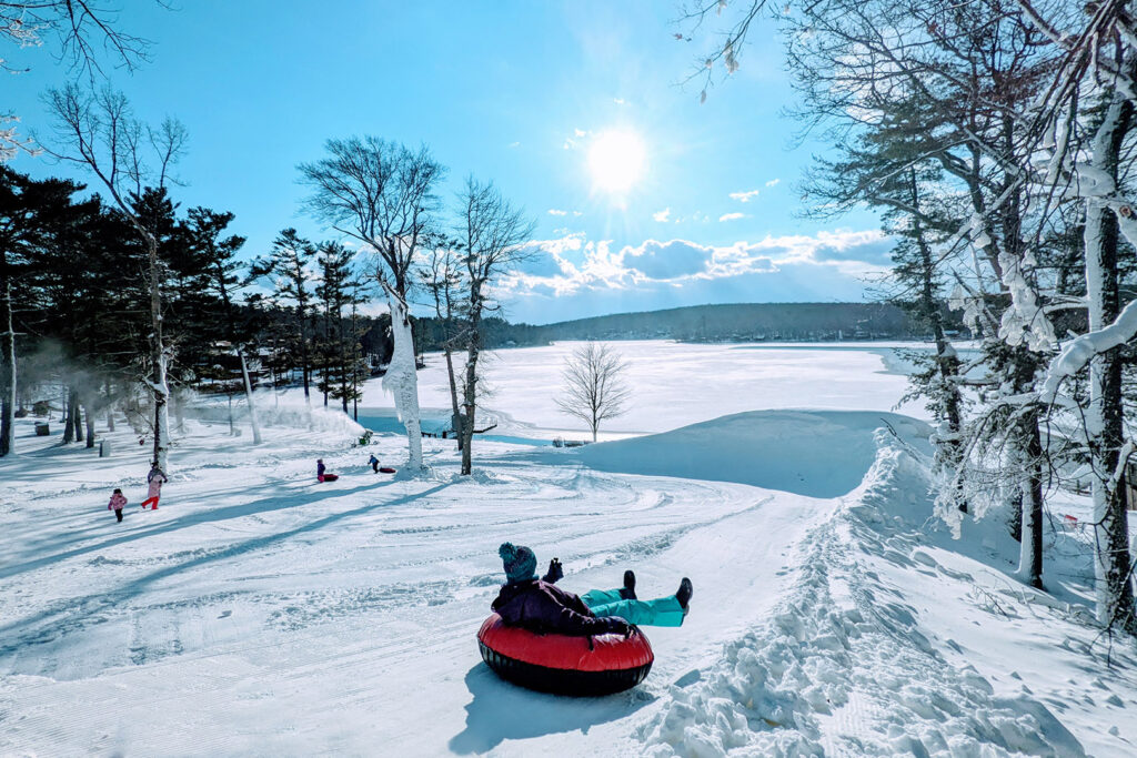 Photo of snow tubing at Woodloch one of the top winter family activities at the resort