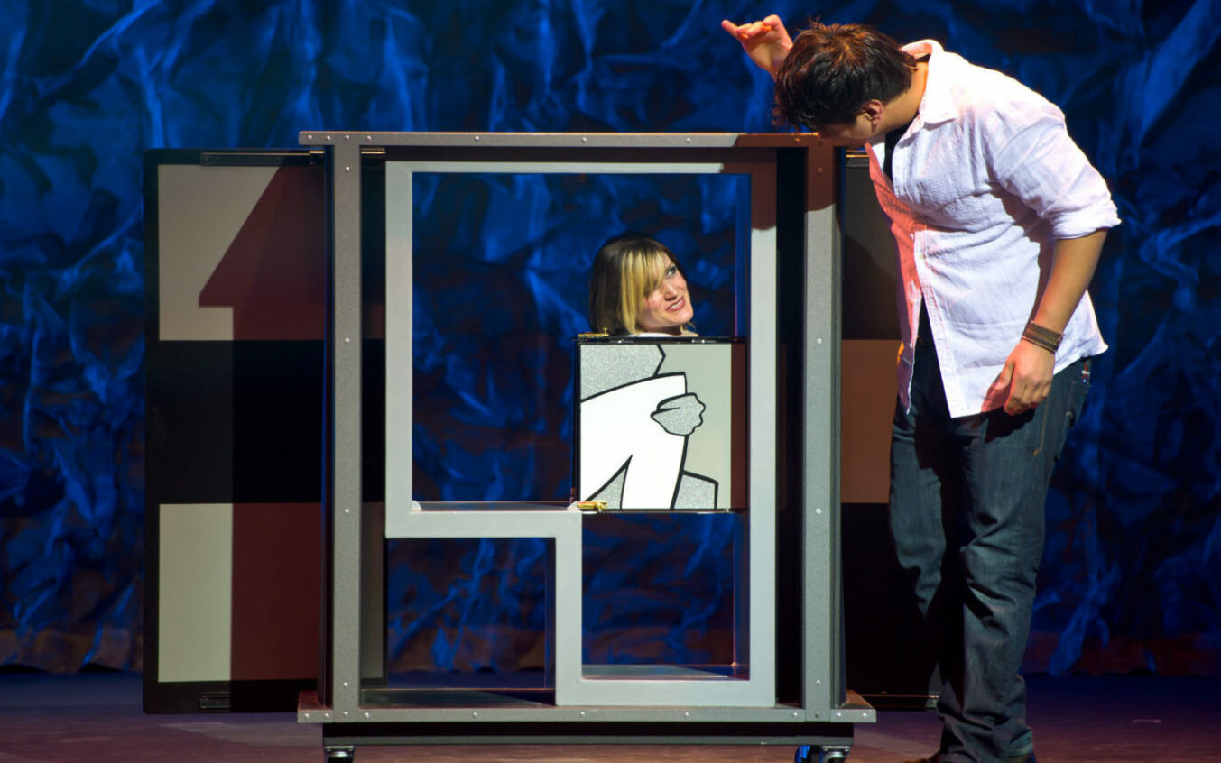 Woman participating in a magic show.