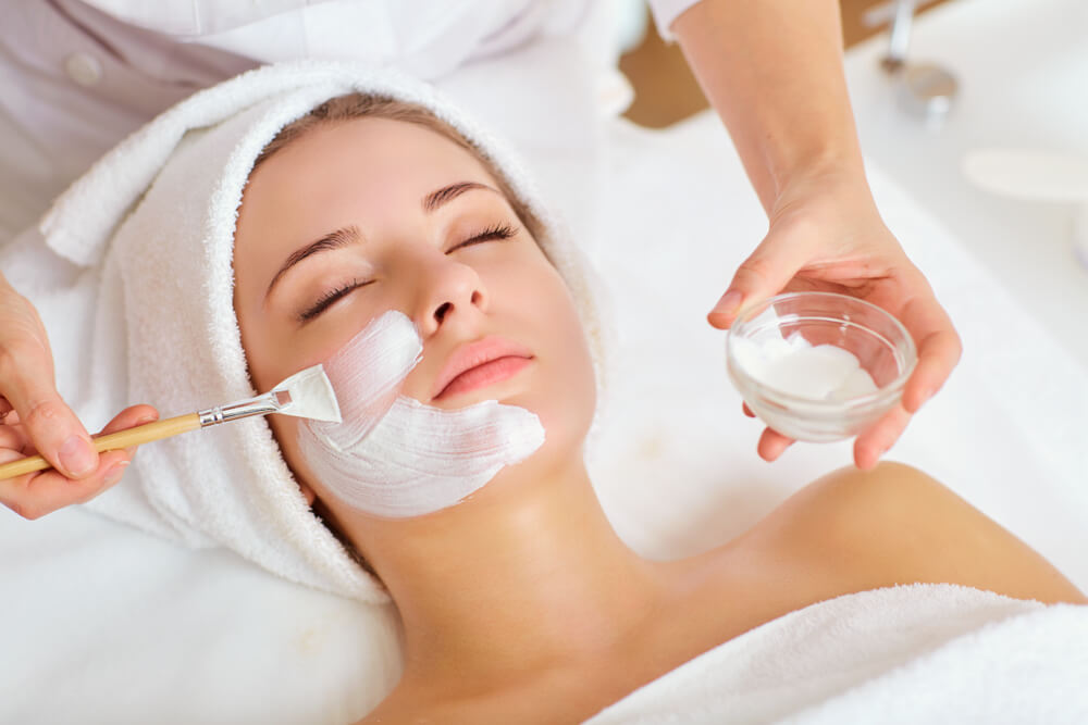 A woman getting a facial at a spa resort in Pennsylvania.