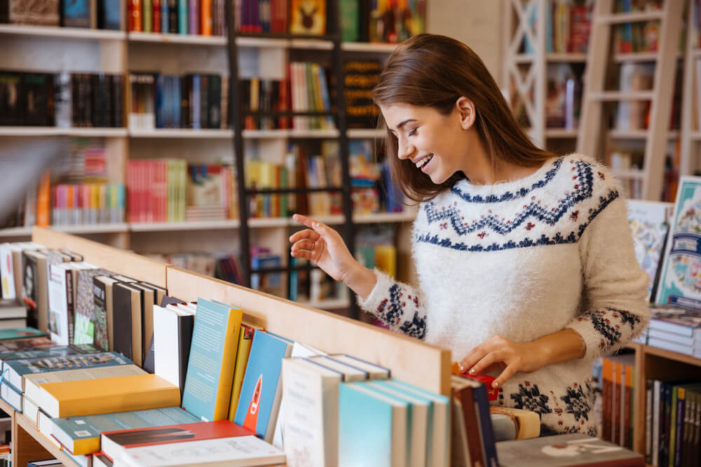 A woman shopping at a bookstore in the Poconos.