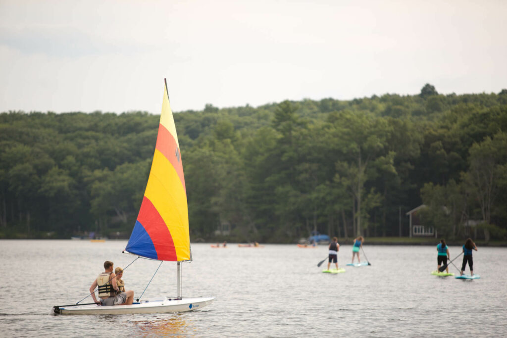 People out on the lake during their vacation to the Poconos in the summer.