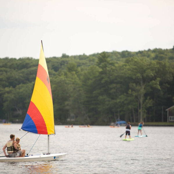 People out on the lake during their vacation to the Poconos in the summer.