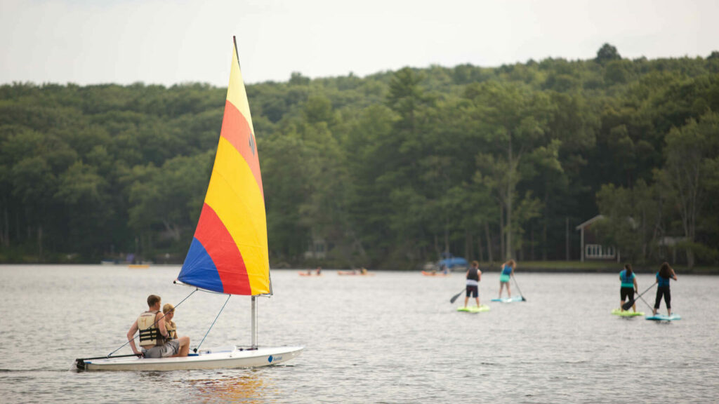 People out on the lake during their vacation to the Poconos in the summer.