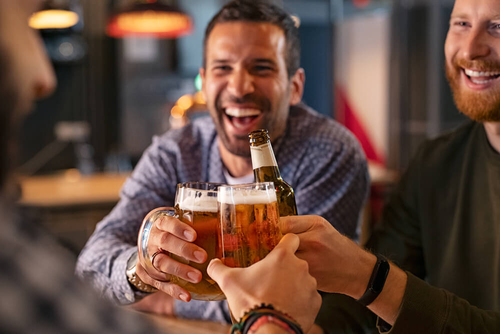 A group of guys at a brewery on a Poconos bachelor party.