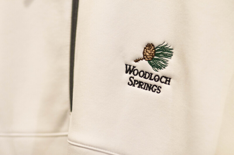 Golf shirt detail. Text: Woodloch Springs.
